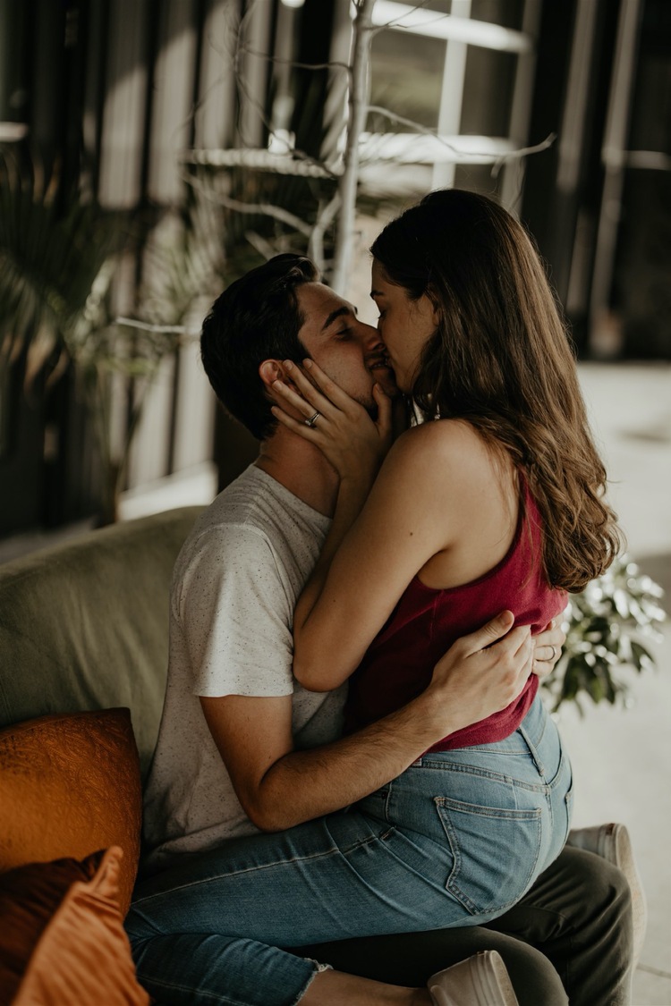 girl sitting on guy lap