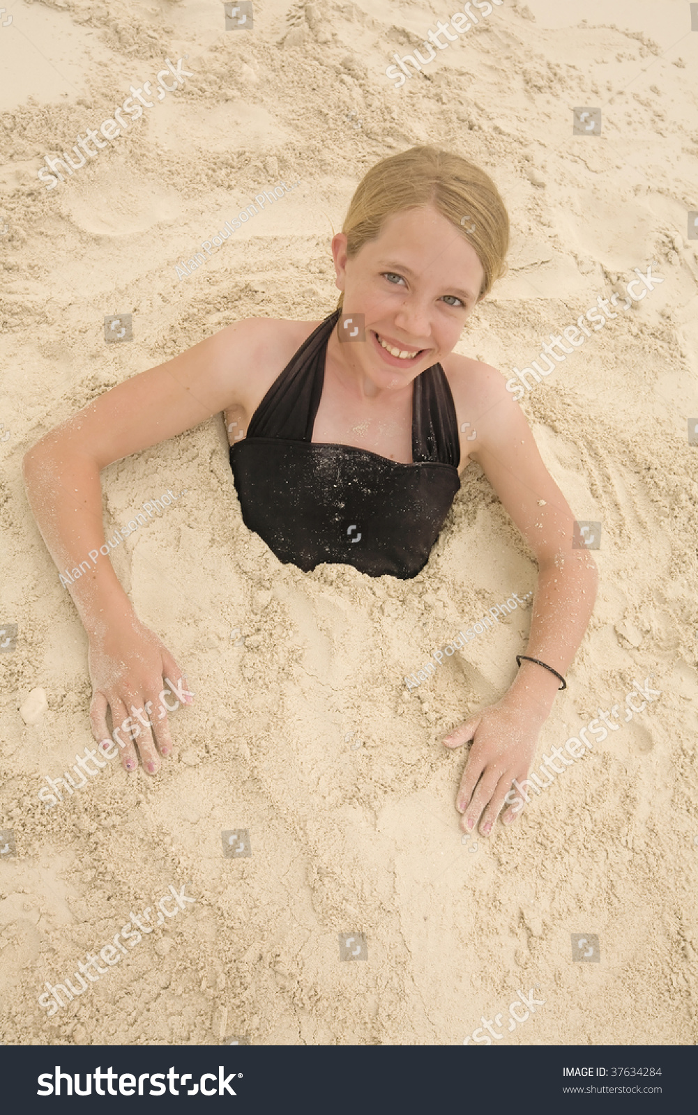 barbara meltzer add women buried in sand photo