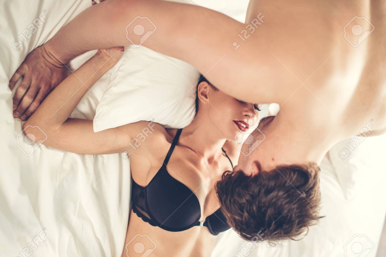man and woman making passionate love