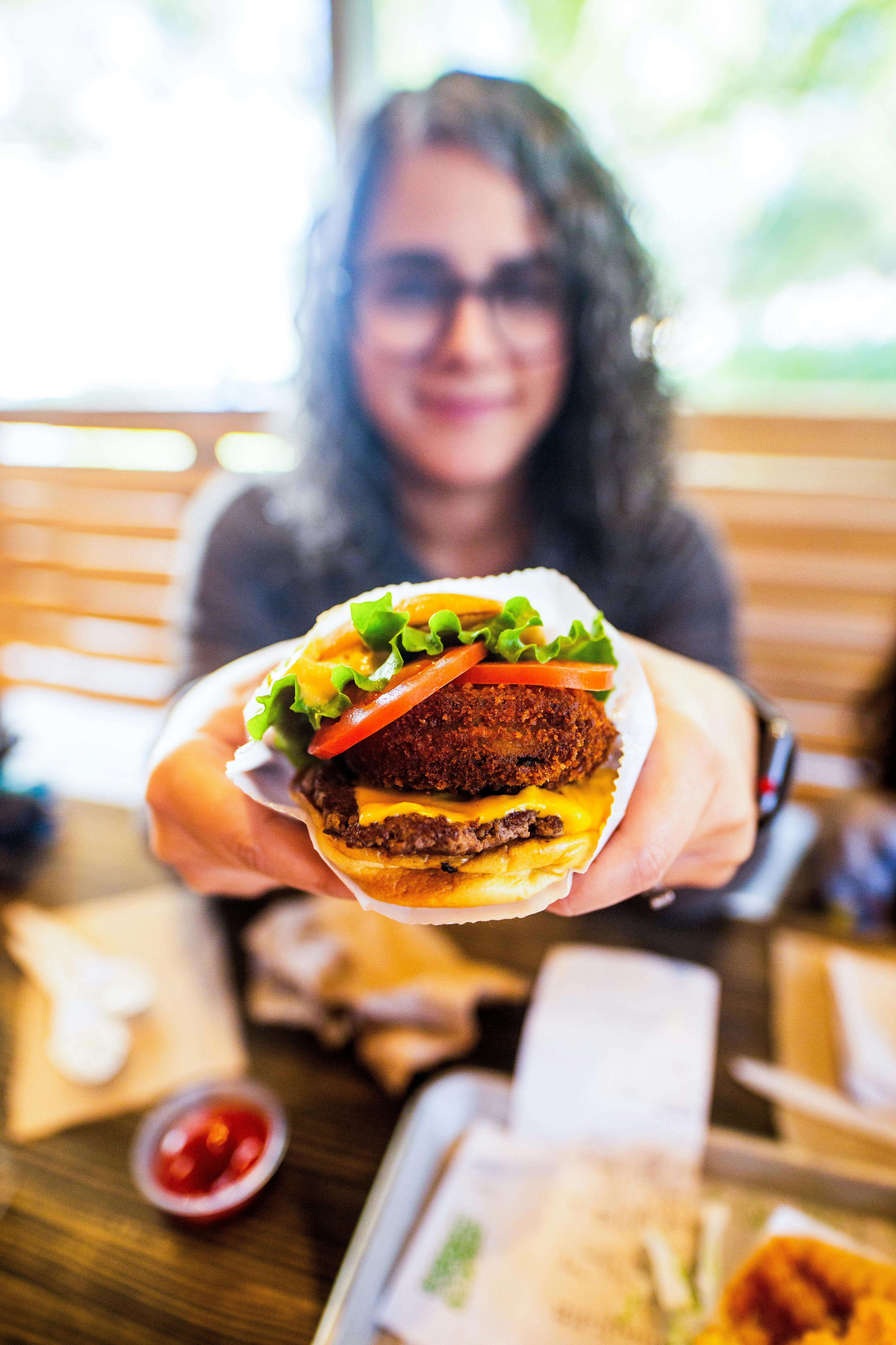 black man eating hamburger