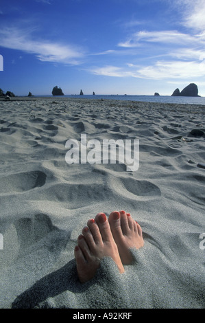 women buried in sand