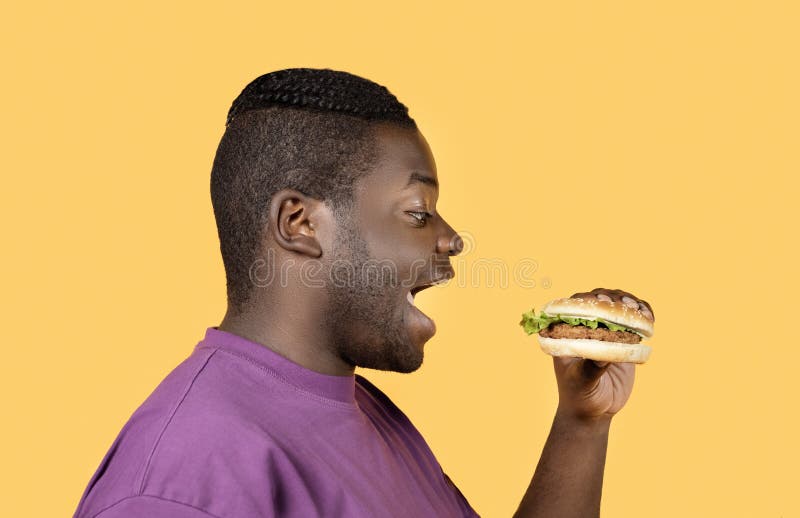 annette paz add black man eating hamburger photo