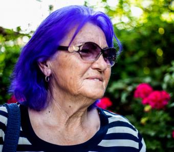 older woman with purple hair