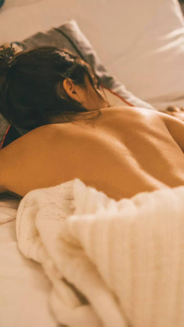 girl sleeping naked in bed