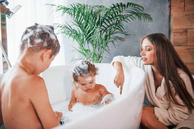 ashley bayliss add mom helps son bath photo