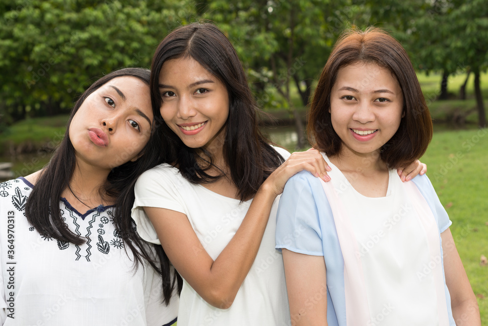 dick lindberg add photo three asian teenagers