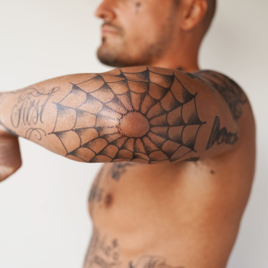 ayah abughoush share web on elbow tattoo photos